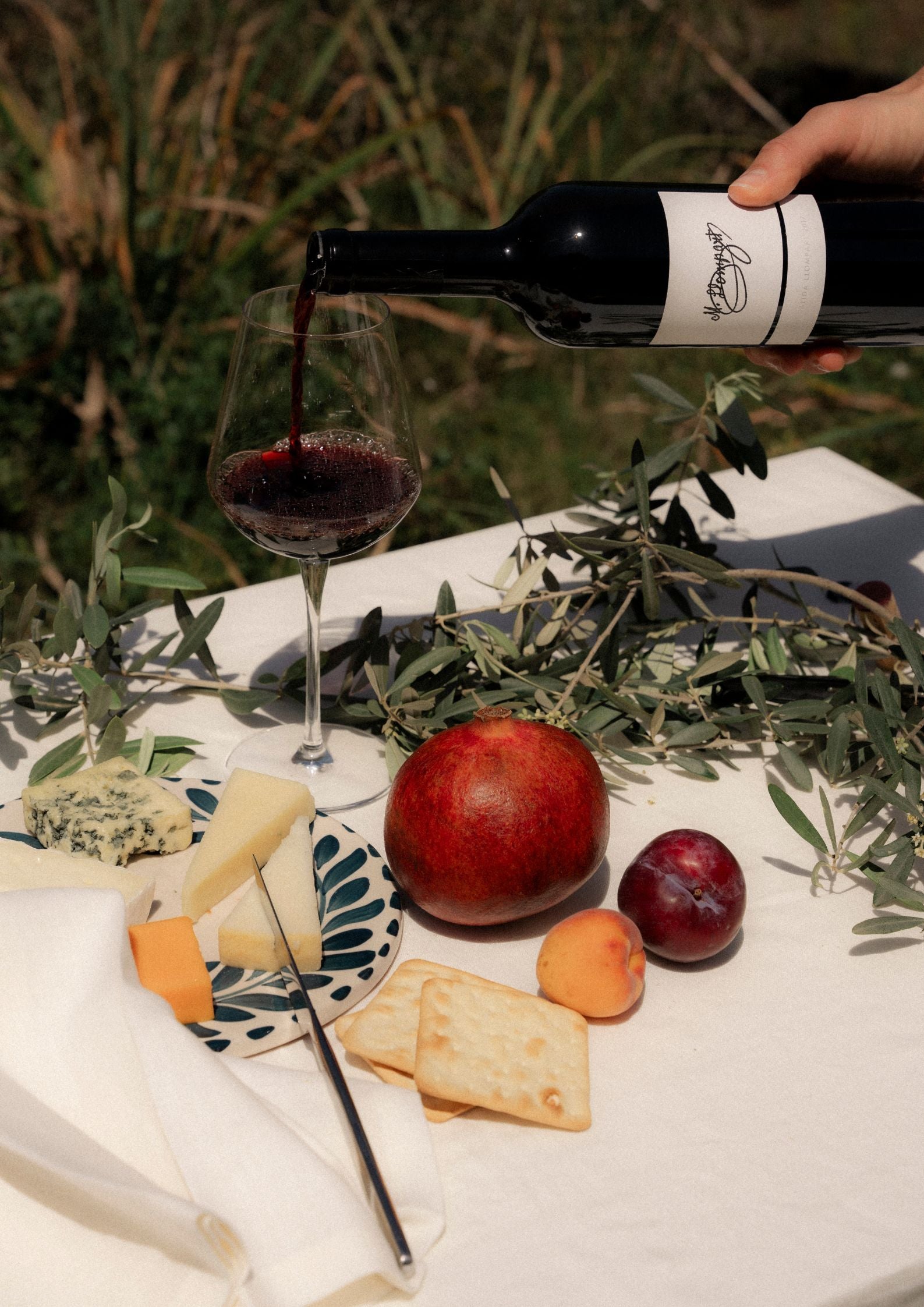 table setting with red wine poured